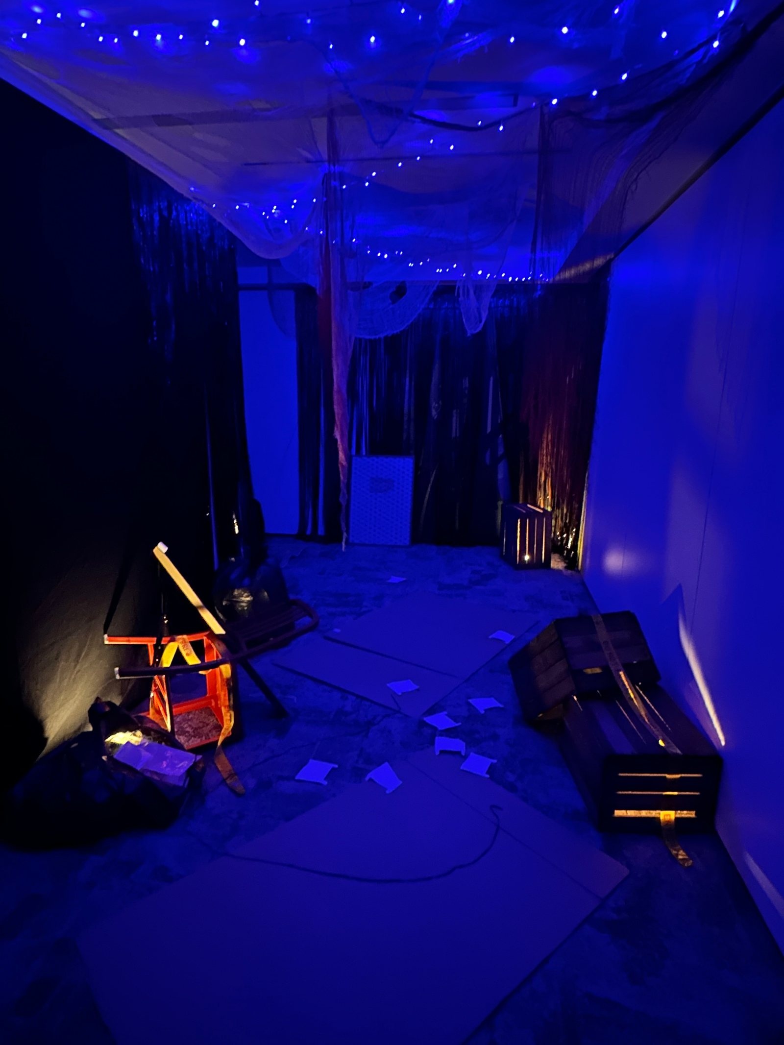 A conference room transformed into an atmospheric horror maze